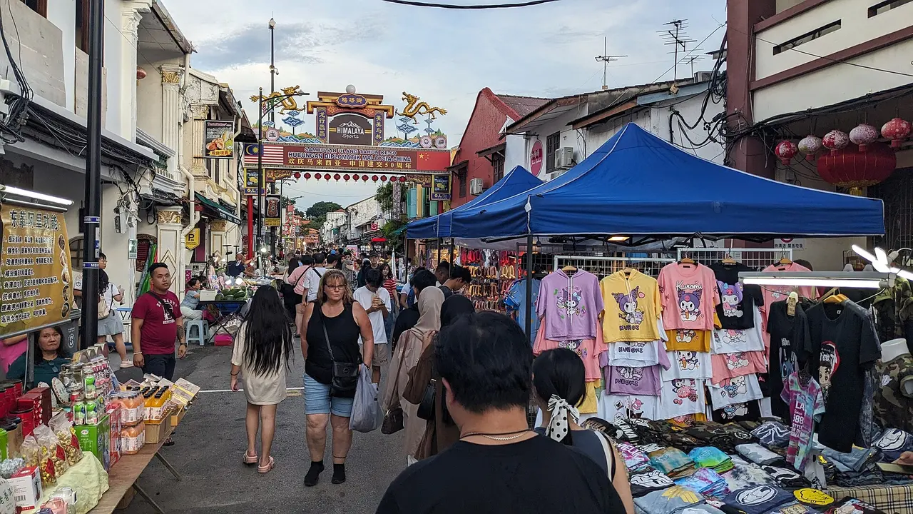 Crowds under the gate of Jonker Street night market in Melaka